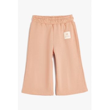 Pantaloni ampli cu banda elastica in talie
