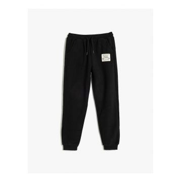 Pantaloni de trening cu buzunare oblice