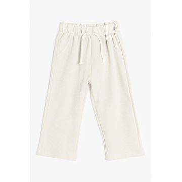 Pantaloni de trening cu croiala ampla si aspect texturat