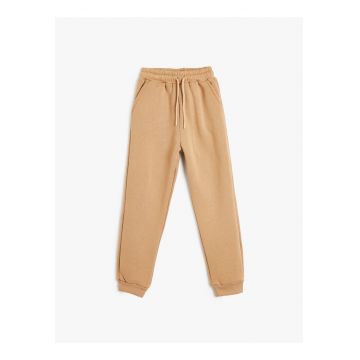 Pantaloni de trening uni cu buzunare oblice