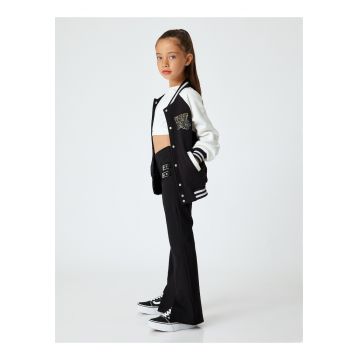 Pantaloni evazati cu slituri frontale