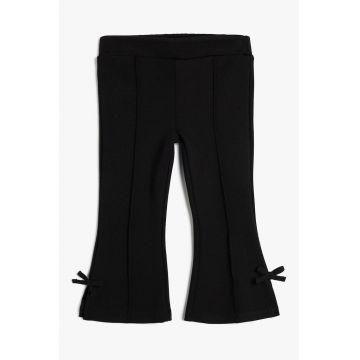 Pantaloni cu croiala ampla si detalii funda