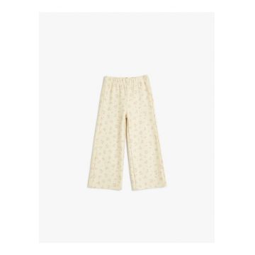 Pantaloni cu croiala ampla si model floral