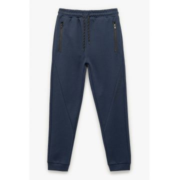 Pantaloni de trening cu buzunare cu fermoar si talie medie