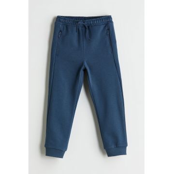 Pantaloni de trening cu buzunare cu fermoar