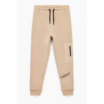 Pantaloni de trening din bumbac cu fenta cu fermoar