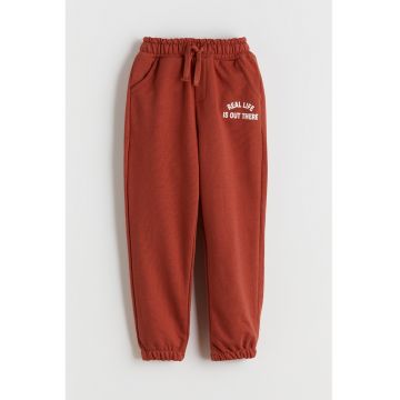 Pantaloni de trening din amestec din bumbac cu imprimeu - Portocaliu stins